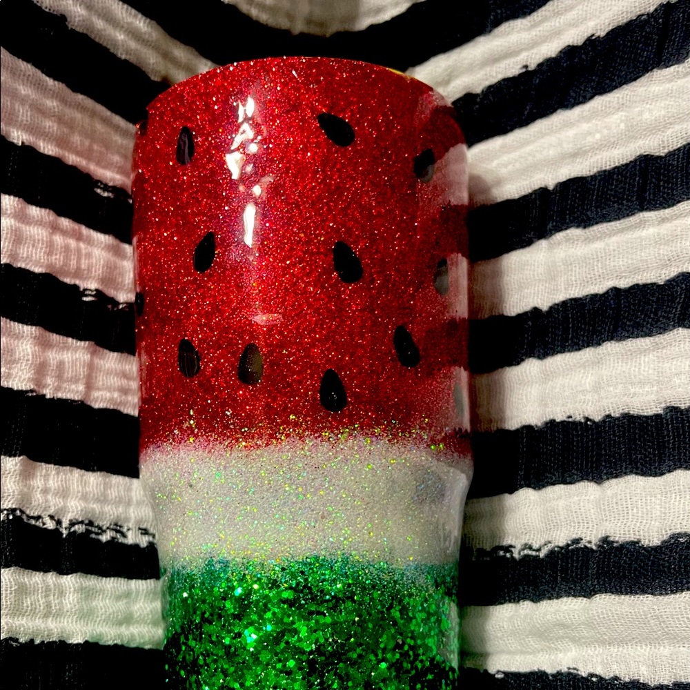 Watermelon Tumbler.  The Orange tumbler has Clemson paw and blue/white anything